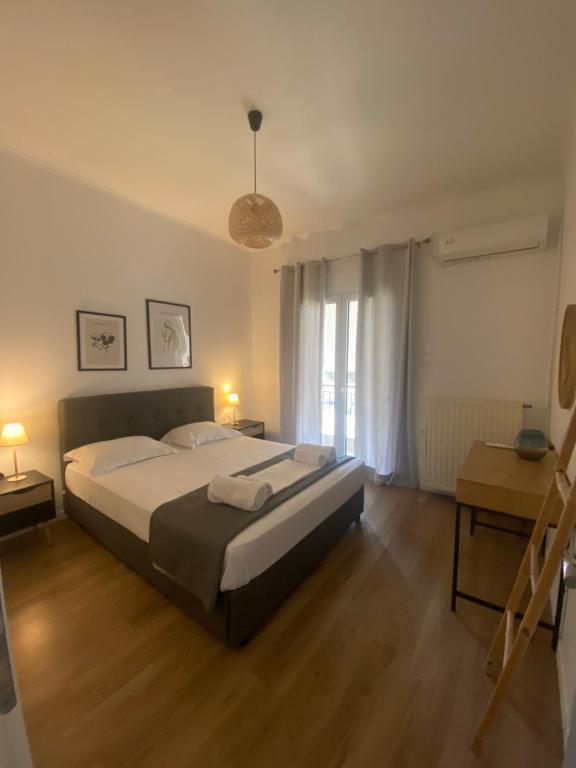 A bed or beds in a room at Menta House