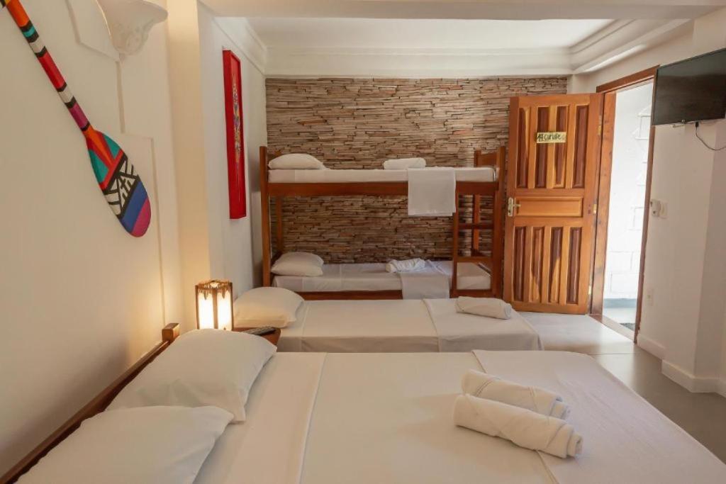 Postel nebo postele na pokoji v ubytování Na Casa 11 - Pousada e Hostel
