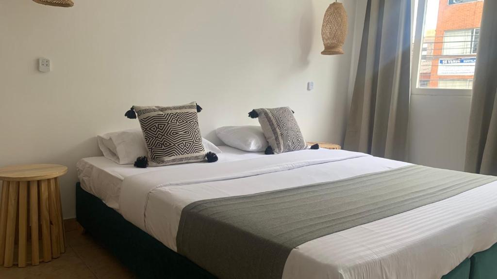 Postel nebo postele na pokoji v ubytování Hotel Quintas de Normandia