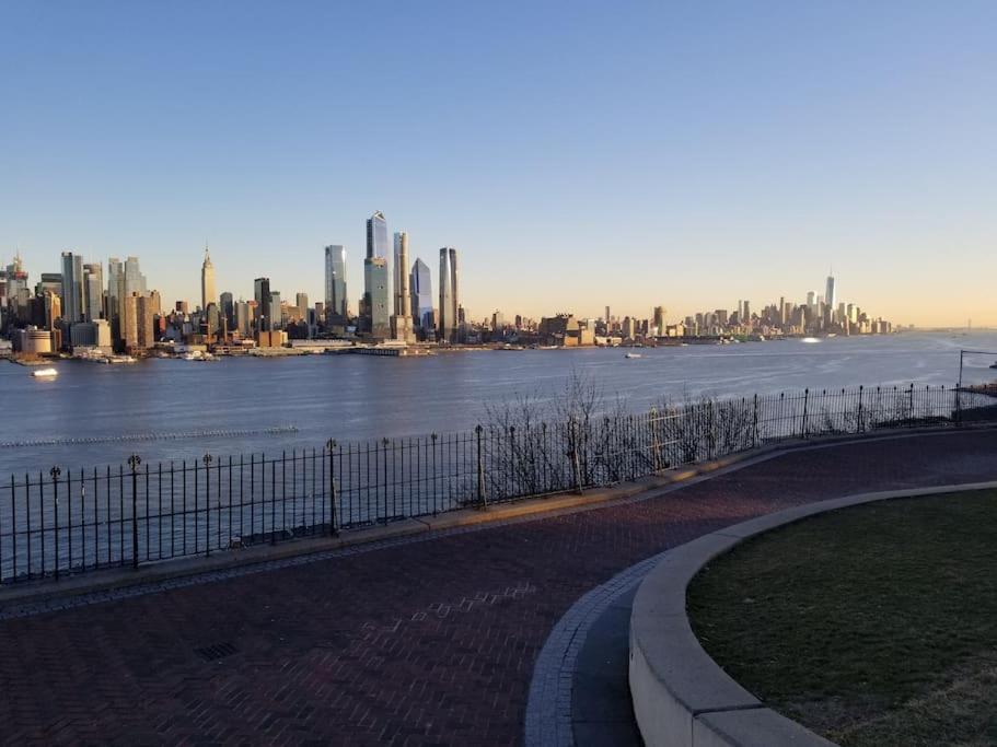 a view of a city with a body of water at Wonderful & Cozy Apartment Close to Time Square NYC in North Bergen