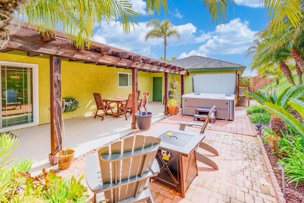 a patio with a table and a grill at CB-5515 - Walk to Beach - Private Hot Tub - Ideal Location in Carlsbad