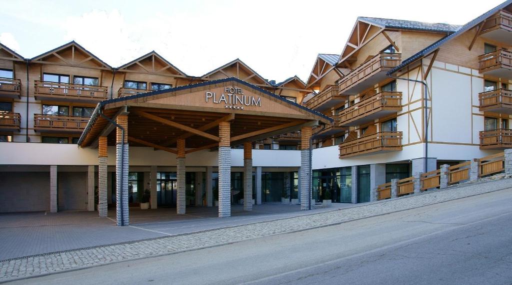 a large building with a sign that reads patagonia at APARTAMENT w PLATINUM MOUNTAIN in Szklarska Poręba