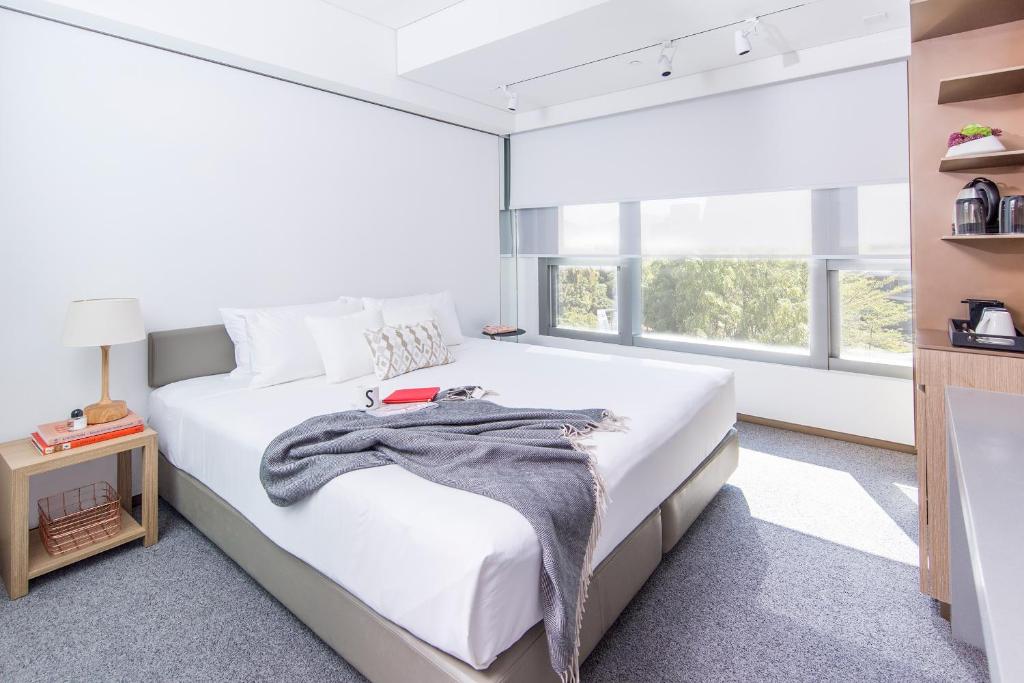 Postel nebo postele na pokoji v ubytování Hotel Stage