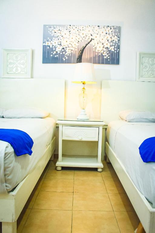 Postel nebo postele na pokoji v ubytování Palacio Canton Hotel - Valladolid
