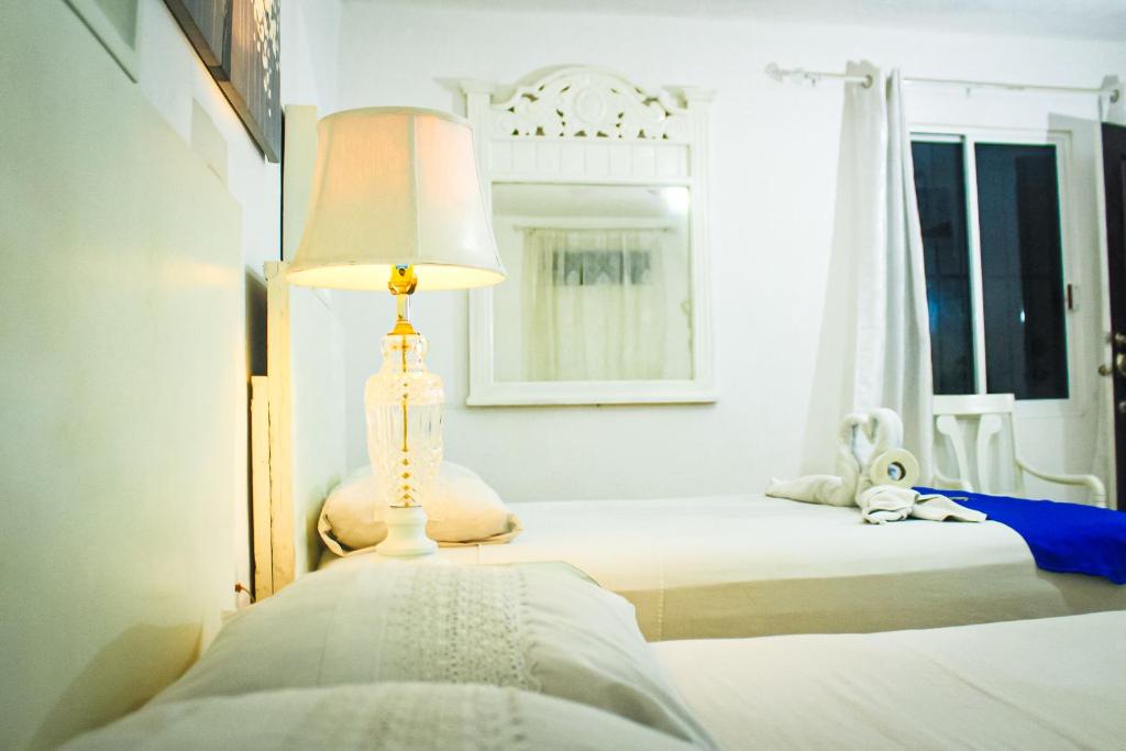 Postel nebo postele na pokoji v ubytování Palacio Canton Hotel - Valladolid