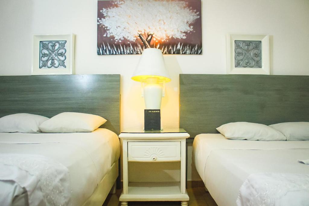 Postel nebo postele na pokoji v ubytování Palacio Canton Hotel - Valladolid