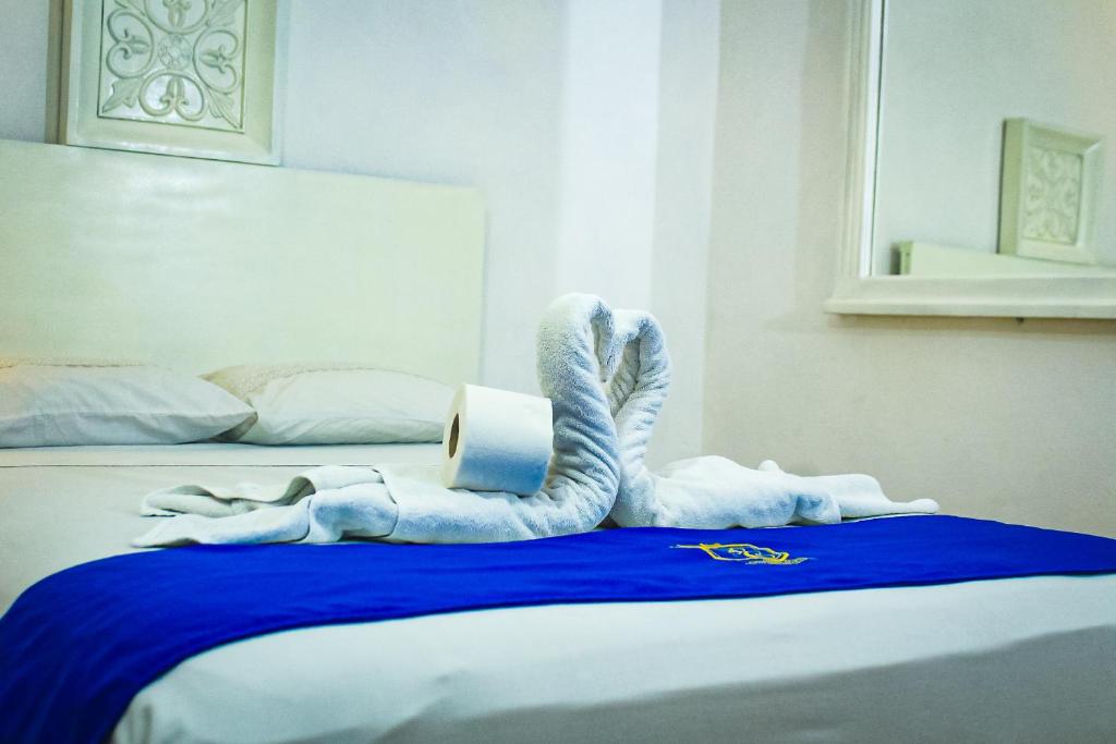 Postel nebo postele na pokoji v ubytování Palacio Canton Hotel - Valladolid