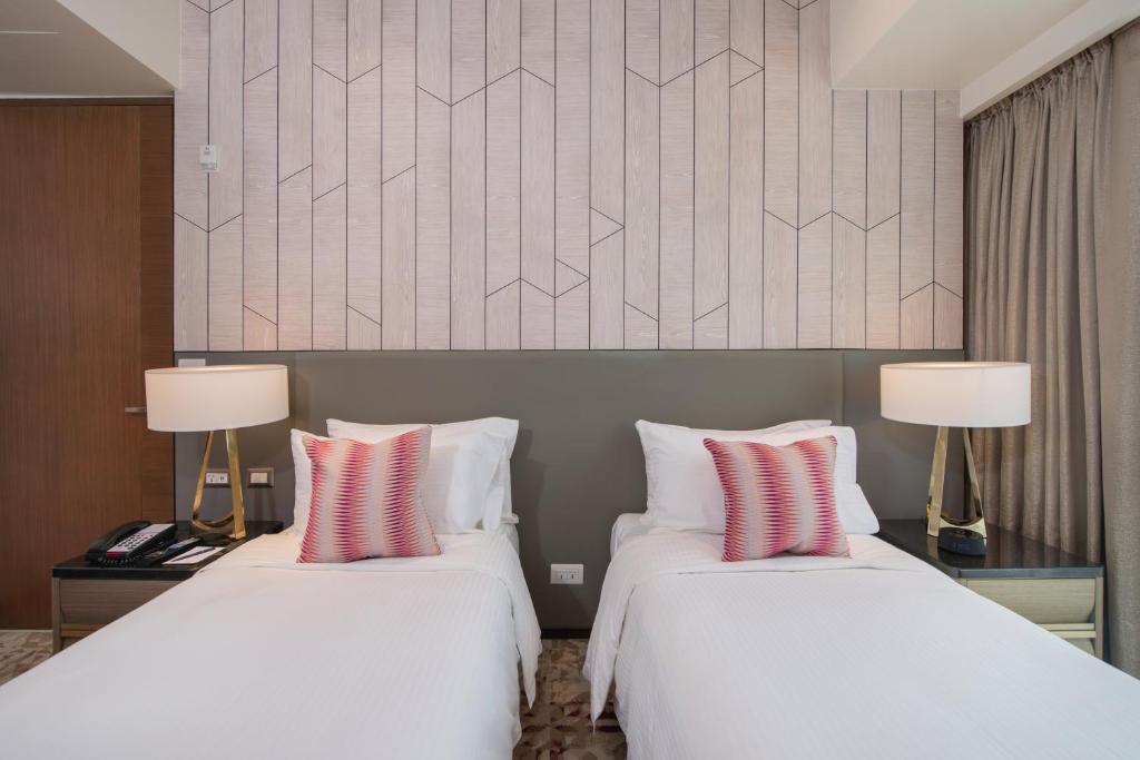 Voodi või voodid majutusasutuse Somerset Central Salcedo Makati toas