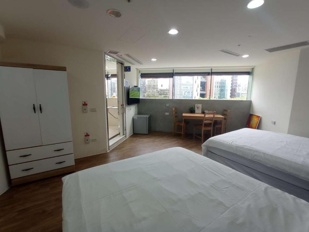 Postel nebo postele na pokoji v ubytování Meworld Hotel - Daan