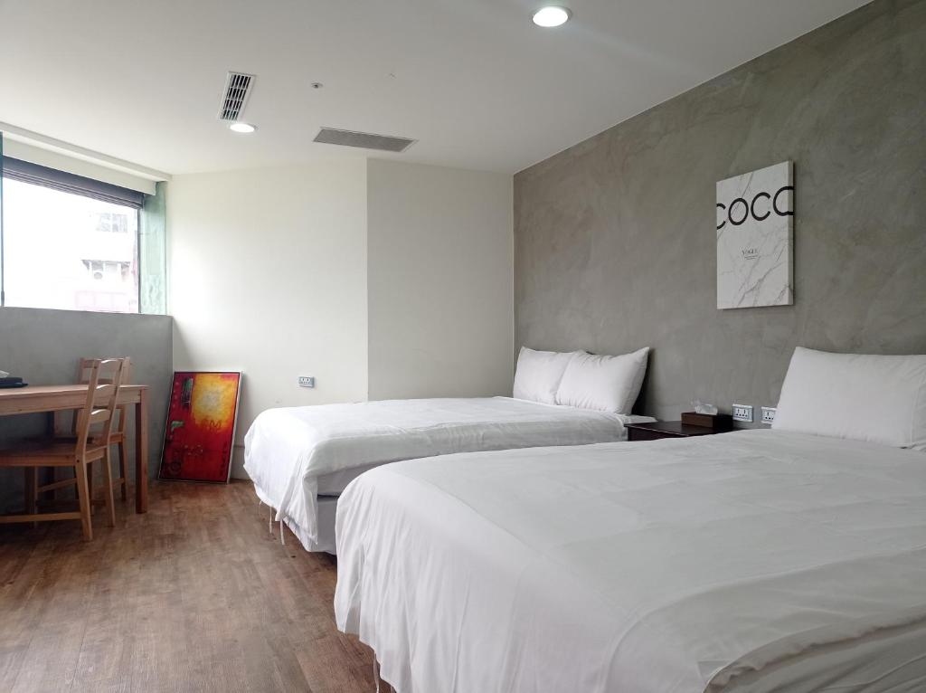Postel nebo postele na pokoji v ubytování Meworld Hotel - Daan