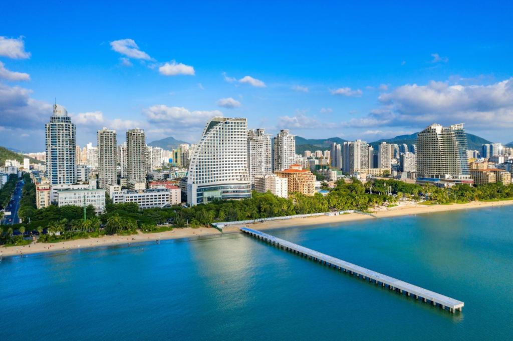 a view of a city with a pier in the water at Four Points by Sheraton Hainan, Sanya in Sanya