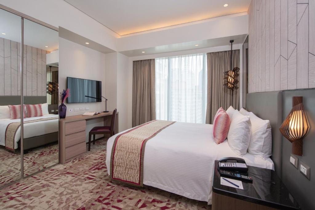 Voodi või voodid majutusasutuse Somerset Central Salcedo Makati toas