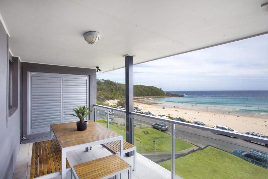 a house with a view of the beach at Beach Road in Mollymook