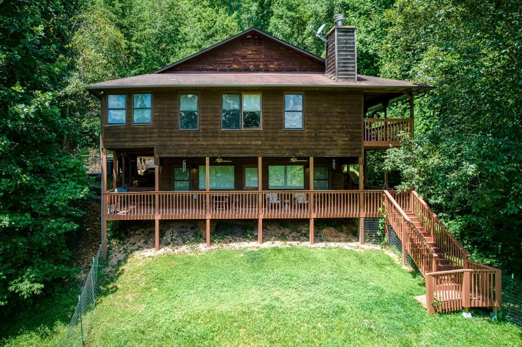 a large wooden house with a large deck at The Nuthouse II, Pool Table, WIFI, 685 FREE tickets each paid day!!! in Sevierville