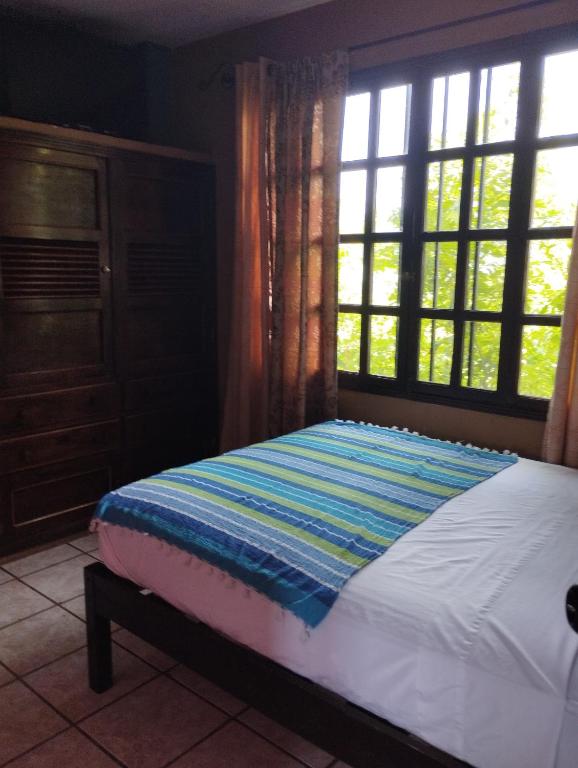 Postel nebo postele na pokoji v ubytování HOTEL EL ALMENDRO