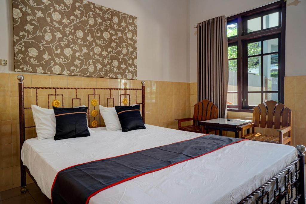 Кровать или кровати в номере Collection O 92868 Nusantara Hotel