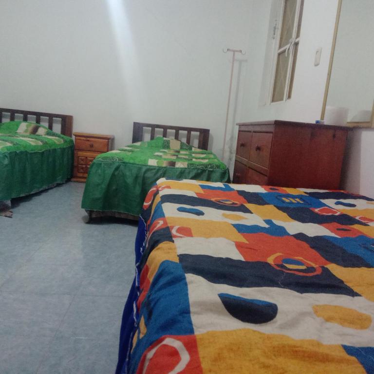 Cama o camas de una habitación en Hostal Eclipse Oaxaca