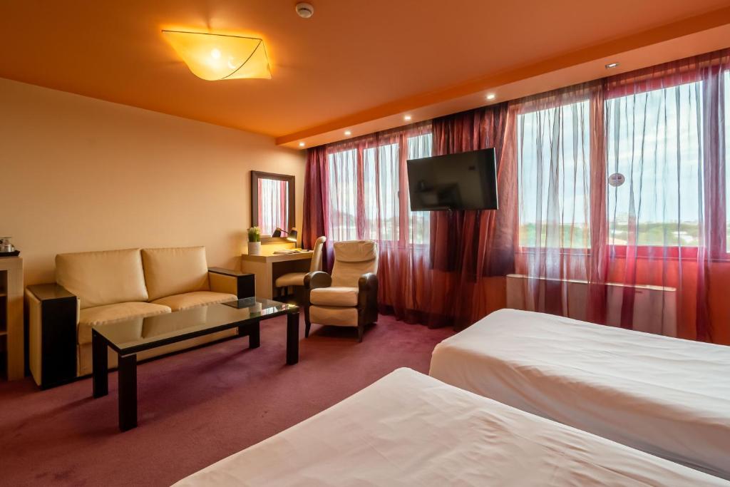 Postel nebo postele na pokoji v ubytování Hotel Leipzig