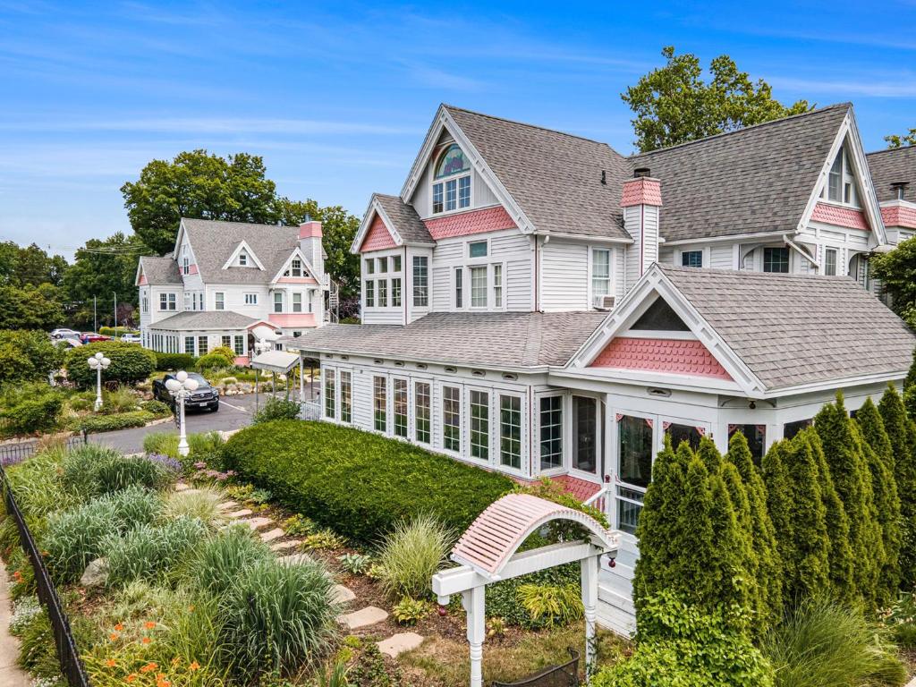 a house with pink and white trim at Yelton Manor Bed and Breakfast in South Haven