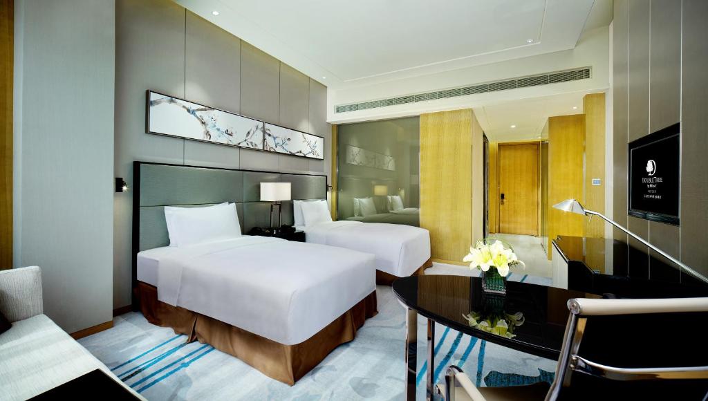 Postel nebo postele na pokoji v ubytování DoubleTree by Hilton Heyuan