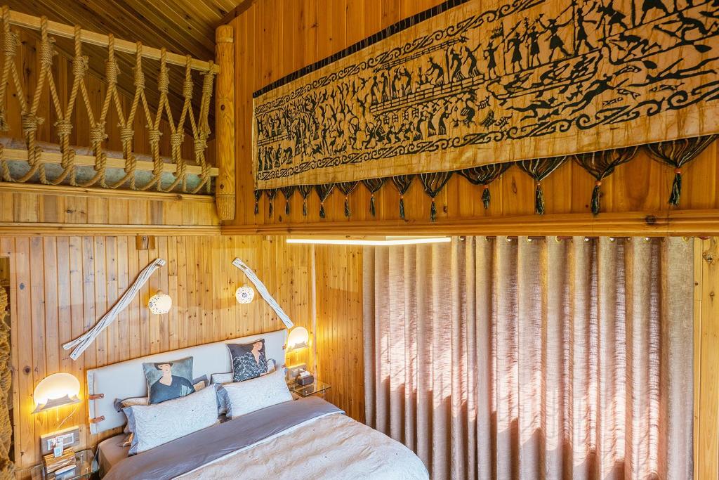 Postel nebo postele na pokoji v ubytování Longji One Art Hotel