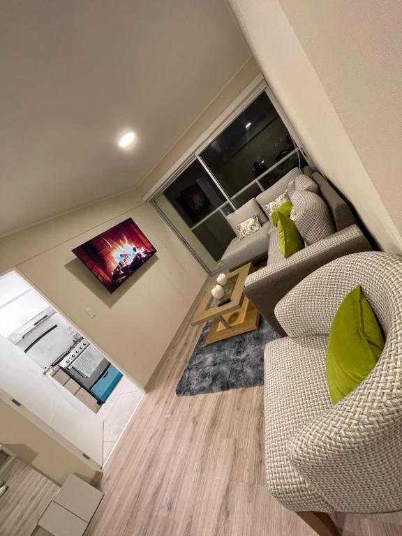 a living room with two chairs and a couch at Departamento de estreno en Zona exclusiva de Surco in Lima