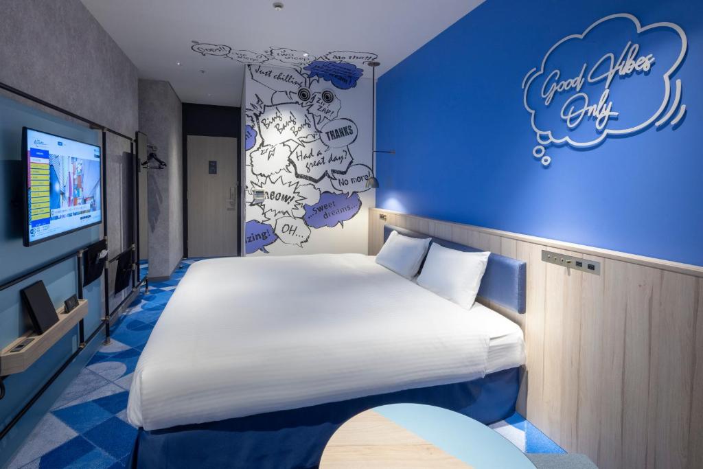 Postel nebo postele na pokoji v ubytování Hotel Kintetsu Universal City