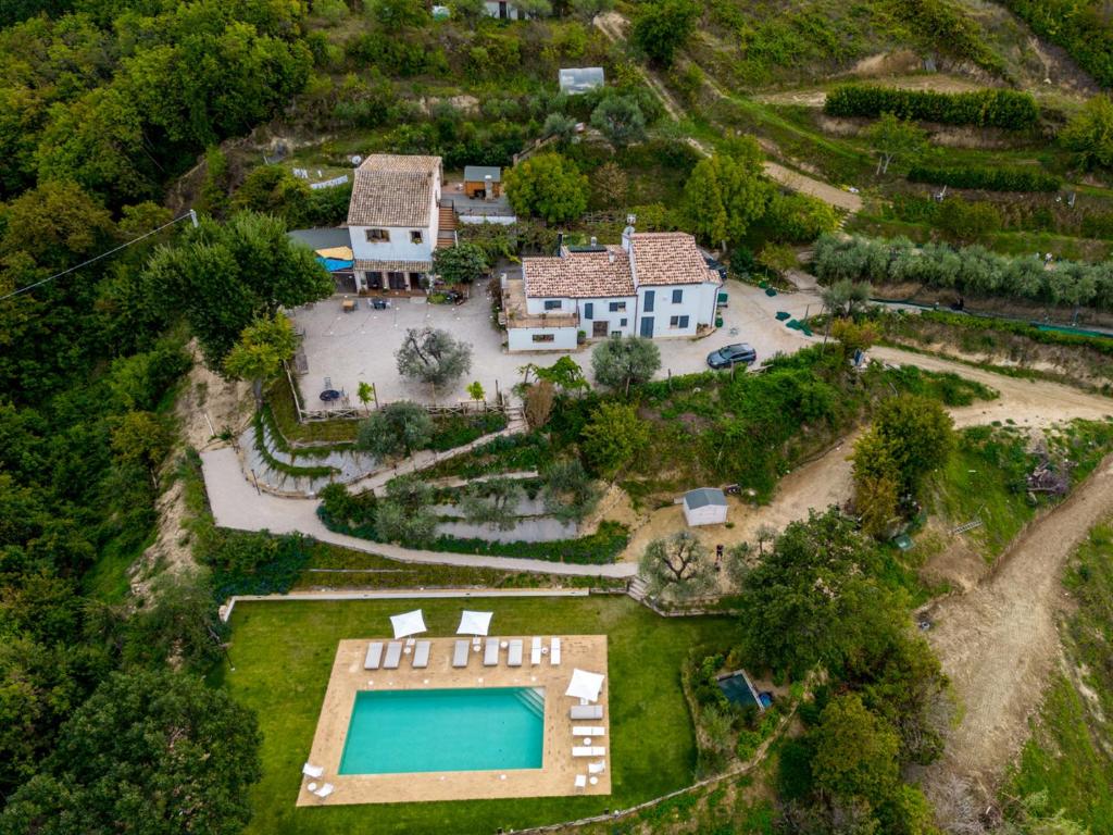 an aerial view of a house with a swimming pool at A Casa Da Angelo - Country House PrivatePool & AirCO in Grottammare