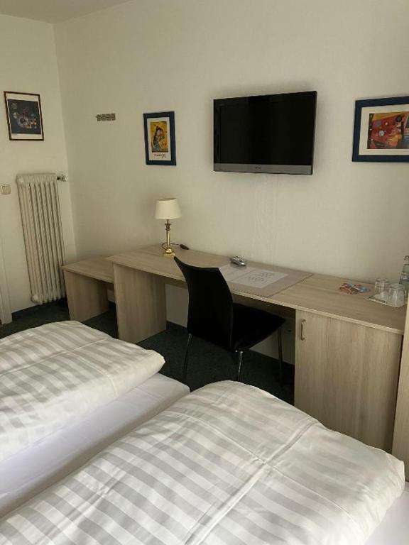 Postel nebo postele na pokoji v ubytování Hotel Occam