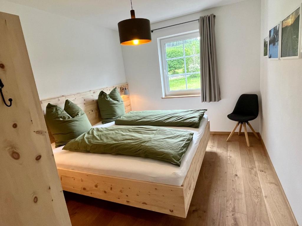 Postel nebo postele na pokoji v ubytování Ferienhaus Fichtenhütte