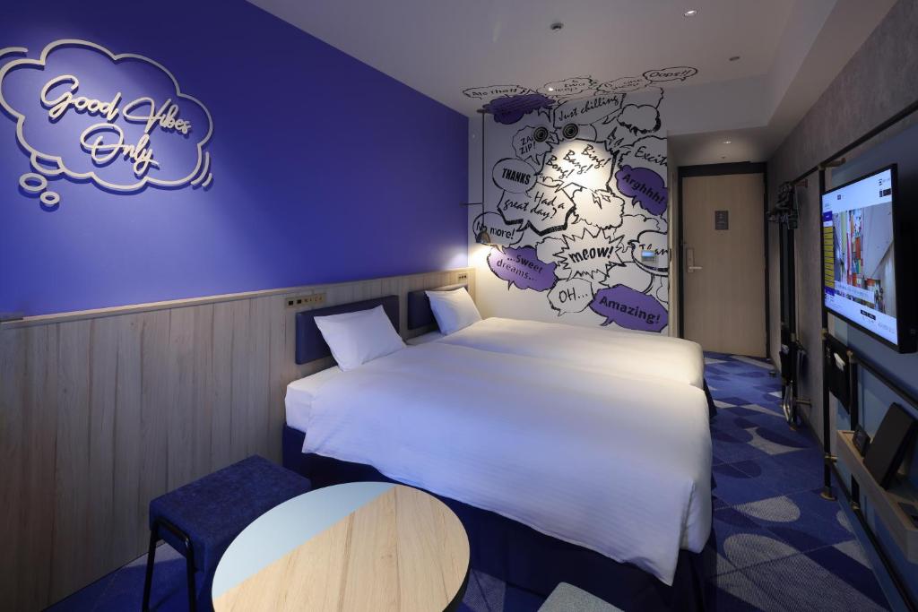Postel nebo postele na pokoji v ubytování Hotel Kintetsu Universal City