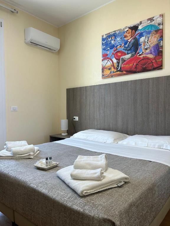 Postel nebo postele na pokoji v ubytování 55 Aira Hotel