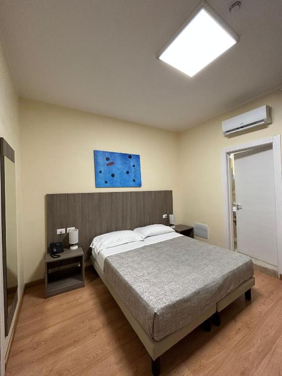 Postel nebo postele na pokoji v ubytování 55 Aira Hotel