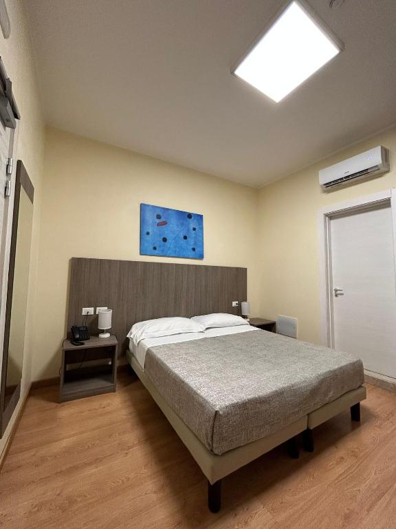 Postel nebo postele na pokoji v ubytování 55 Aira Hotel