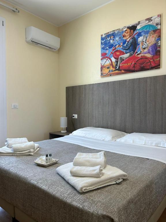 Postel nebo postele na pokoji v ubytování 55 Aira Hotel
