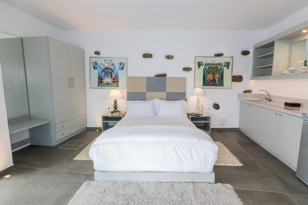 Postel nebo postele na pokoji v ubytování Greco Philia Hotel Boutique