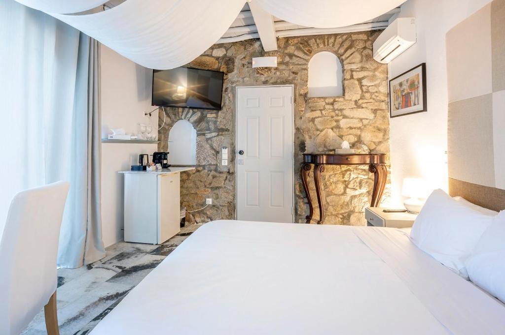 Postel nebo postele na pokoji v ubytování Greco Philia Hotel Boutique