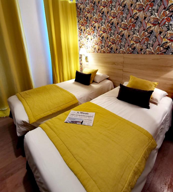 Postel nebo postele na pokoji v ubytování Grand Hôtel Brive