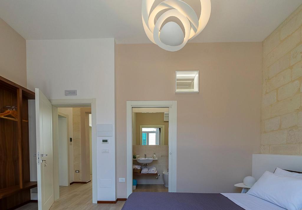 Postel nebo postele na pokoji v ubytování LecceMia B&B