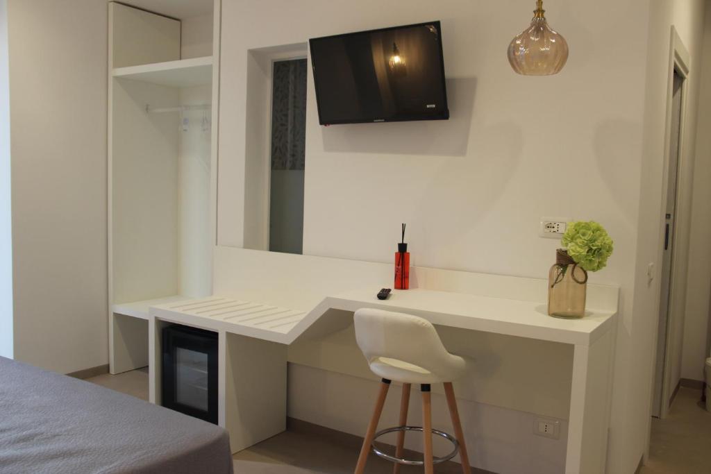 TV a/nebo společenská místnost v ubytování Le Dune Luxury Rooms