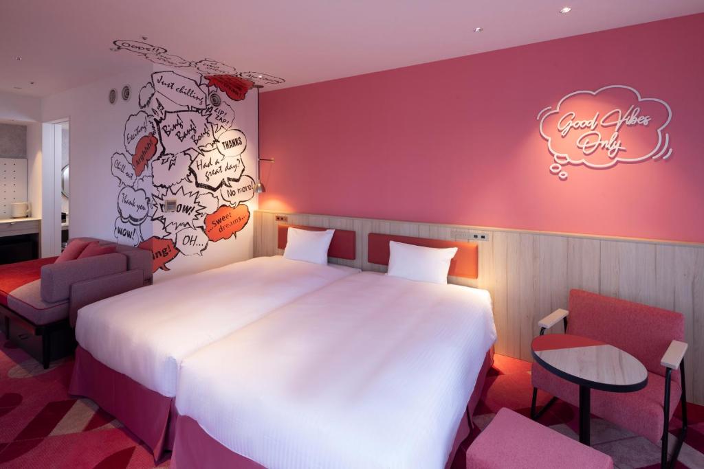 Postel nebo postele na pokoji v ubytování Hotel Kintetsu Universal City