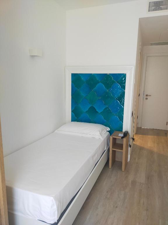 Łóżko lub łóżka w pokoju w obiekcie Splendid Hotel Taormina