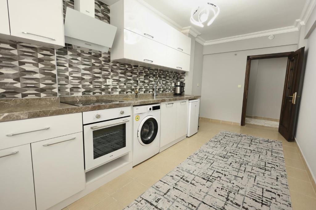 Kuchyň nebo kuchyňský kout v ubytování Golden Homes