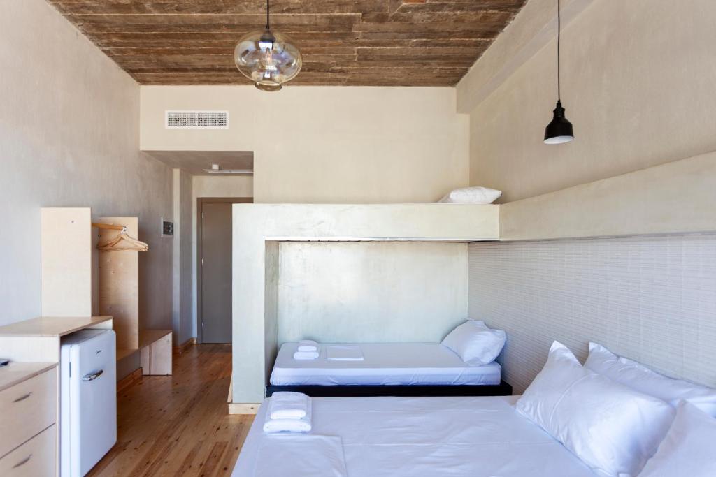 Postel nebo postele na pokoji v ubytování Toni Retzo Rooms