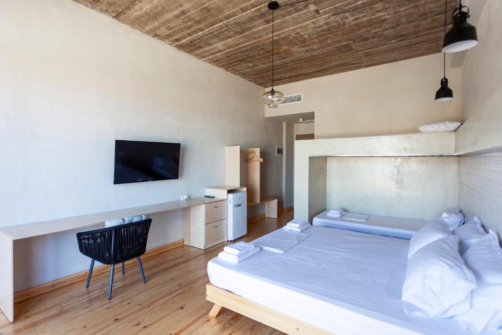 Postel nebo postele na pokoji v ubytování Toni Retzo Rooms