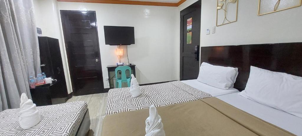 Postel nebo postele na pokoji v ubytování ISLAND VIEW SUITES