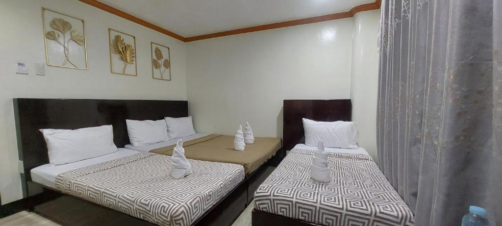 Postel nebo postele na pokoji v ubytování ISLAND VIEW SUITES