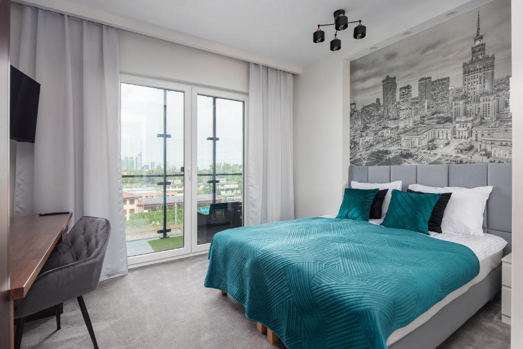 Un pat sau paturi într-o cameră la New Varsovia Comfort 546