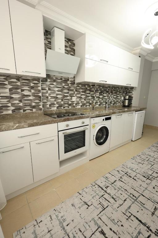 Kuchyň nebo kuchyňský kout v ubytování Golden Homes