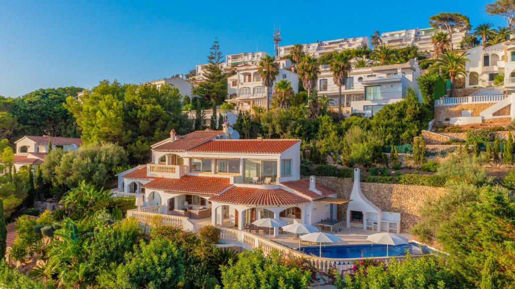 an aerial view of a large house on a hill at Villa Maitreya By MENORCARENTALS in Son Bou